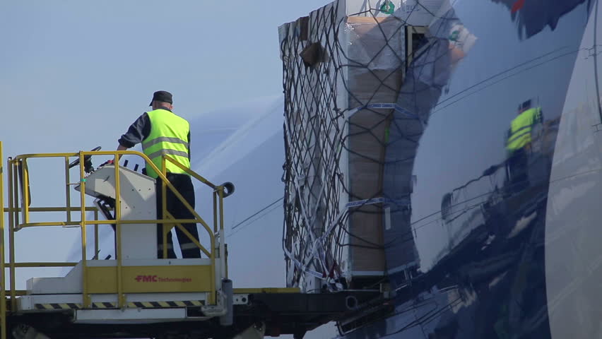 NOVOSIBIRSK, RUSSIA - JUNE 22: Unloading of cargo from the aircraft at the airport on June 22, 2012 in Novosibirsk, Russia.