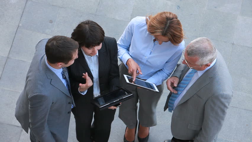 Business team holding an outdoor discussion, new technologies bring new opportunities