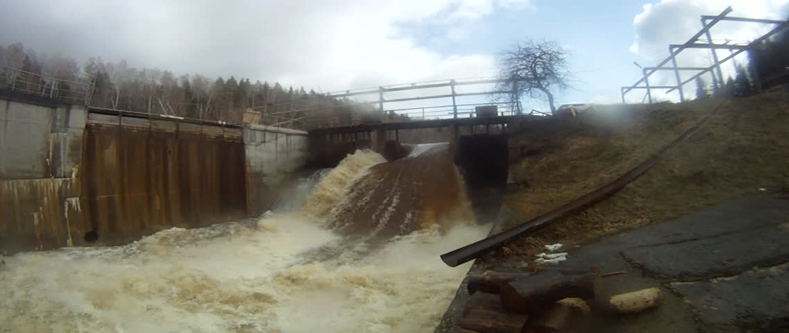 Dam releasing water at the Riga Hydroelectric Power Plant (or Riga HES), located along the Daugava River, in Riga, Latvia.