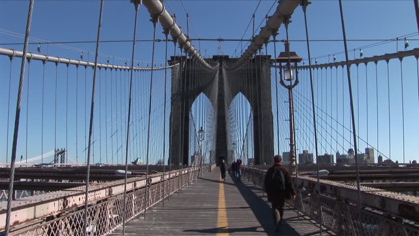 New York, NY - CIRCA March 2006: The footpath of the Brooklyn Bridge hosts thousands of commuters and tourists everyday