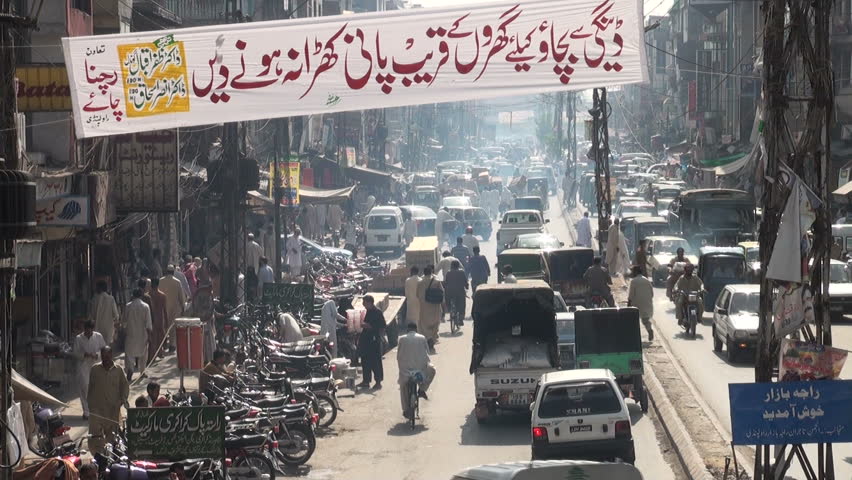 RAWALPINDI - 17 OCTOBER 2010: Traffic drives over a busy road in the centre of Rawalpindi, twin city of Islamabad, Pakistan