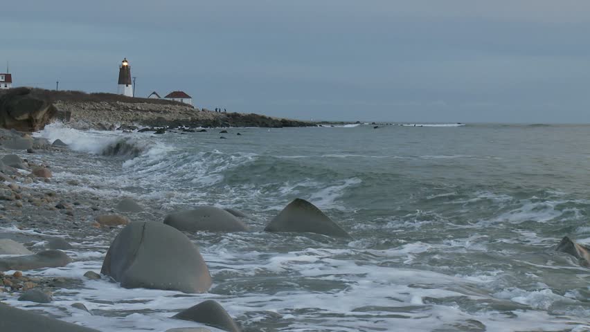 Point Judith Lighthouse with waves crashing in foreground