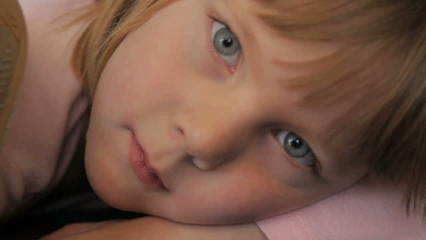 Close up of a little girl resting in a preschool class