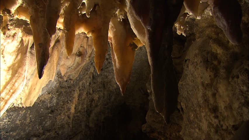 Row of stalactites with dramatic lighting