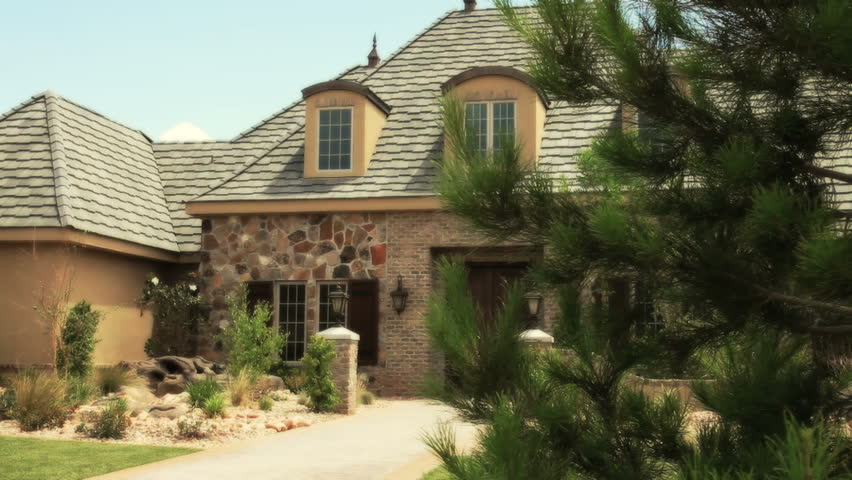 upscale home with flagstone entry