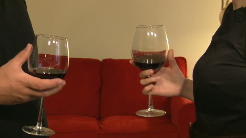 making a toast with a glass of vine by young couple
