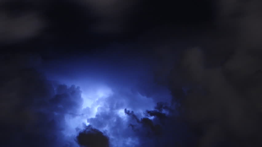 Time lapse of severe thunderstorm clouds at night with lightning