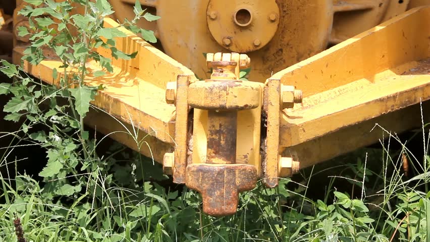 Male Hand Works Heavy Equipment Link Pin Loose And Removes Then Puts Back