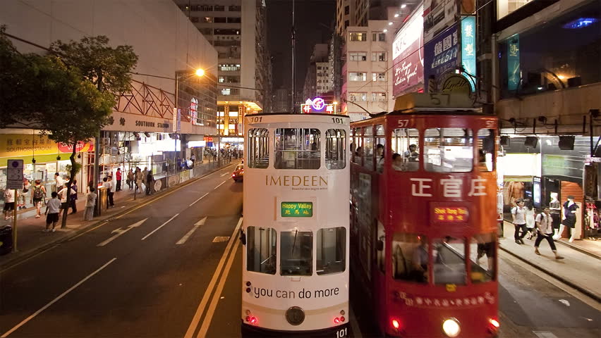 HONG KONG - CIRCA MAY 2011: shot of a Tram on busy city streets at night
