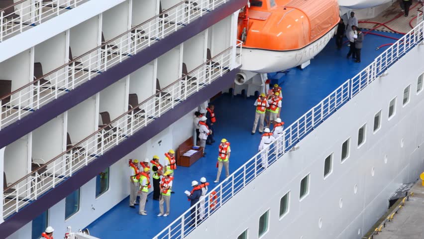 saving training of personnel in jacket on board passenger liner close up