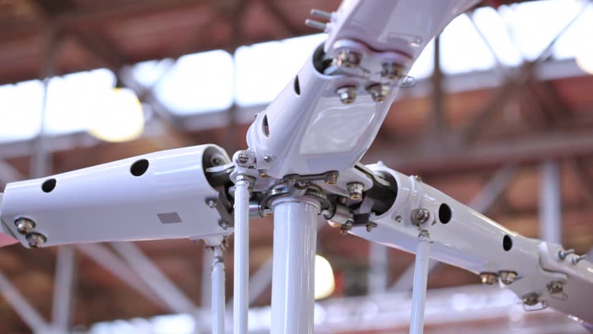 White screw of helicopter stands closeup against roof of exhibition area