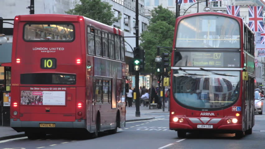 LONDON - MAY 14: Police car with flashing lights and siren races down Oxford Street on May 14, 2012 in London.