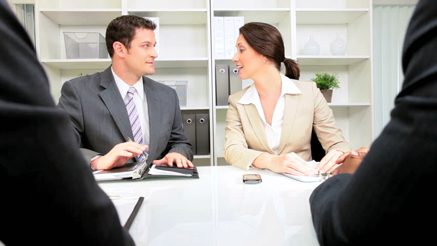 Multi ethnic legal team meeting business clients