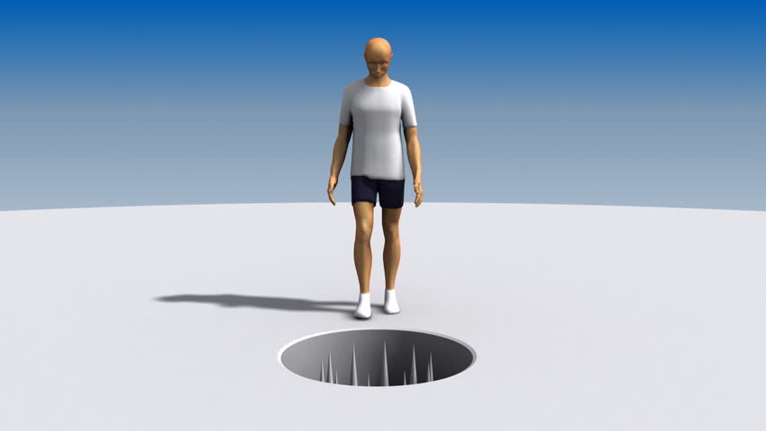 Man walks toward an open hole full of spikes. He stops before he falls in then a big weight squashes him.
