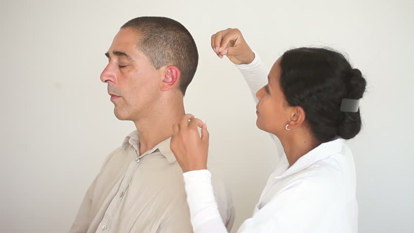 Alternative Medicine: Female Doctor Applying Acupuncture Needles