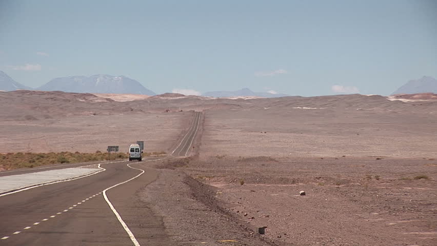 Van on the road in the Atacama Desert, Chile