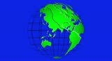 Spinning globe with the continents in green on a wire frame against a blue screen background