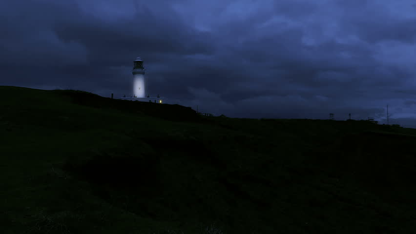 A Night For Day Composition Of A Lighthouse Shining Brightly Out To Sea 