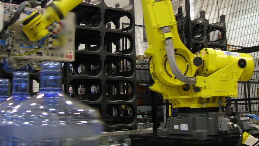 Bottled water factory. Big robotic hands. Production line. Time lapse, loopable.