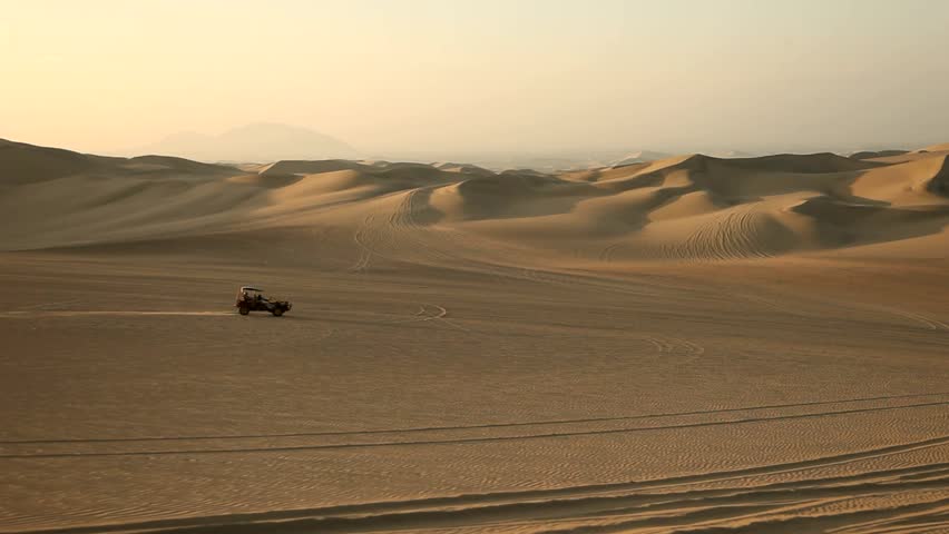 footage of driving with a buggy off-road in the dunes of Ica, Peru