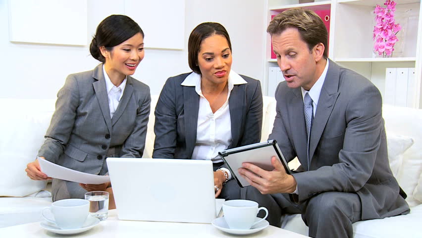 Male Caucasian executive informal meeting with multi ethnic business team