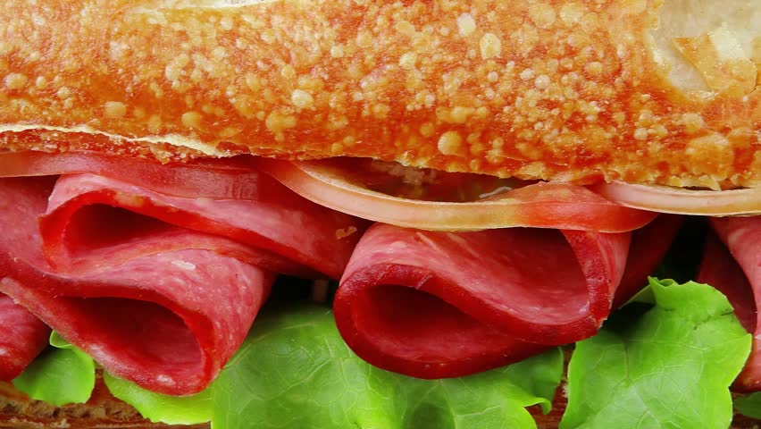french long baguette with smoked chicken sausage on wood over black