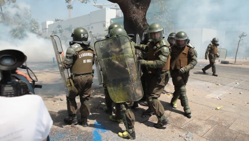 SANTIAGO, CHILE - OCTOBER 19: Chilean riot disperse protesters during a student strike on October 19, 2011 in Santiago, Chile. Protesters demand the government to improve education quality