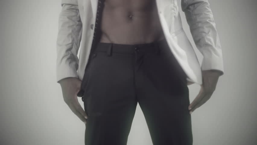 young african body waving and dancing with a cool attitude and elegant suite on a silver style