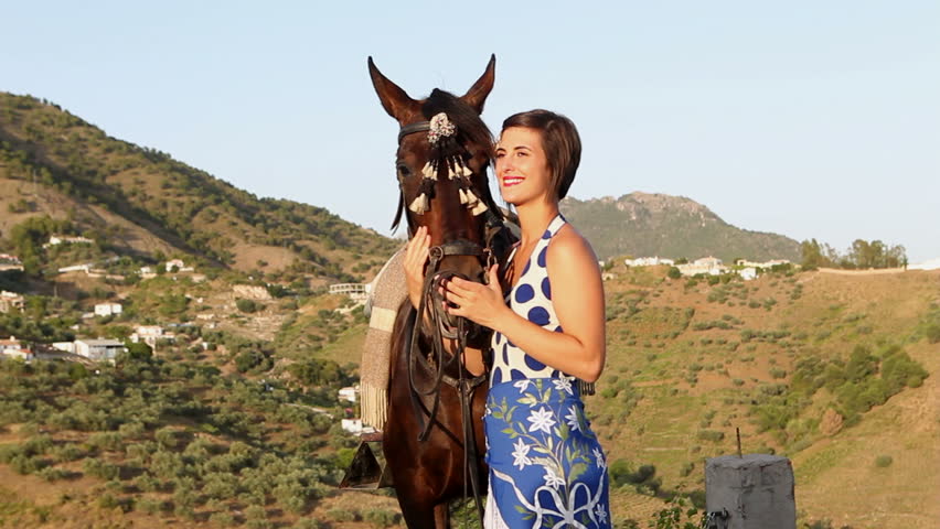 Woman cuddling a horse in Andalusia, Spain