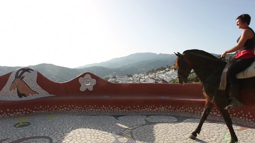 Woman riding a horse in Andalusia, Spain