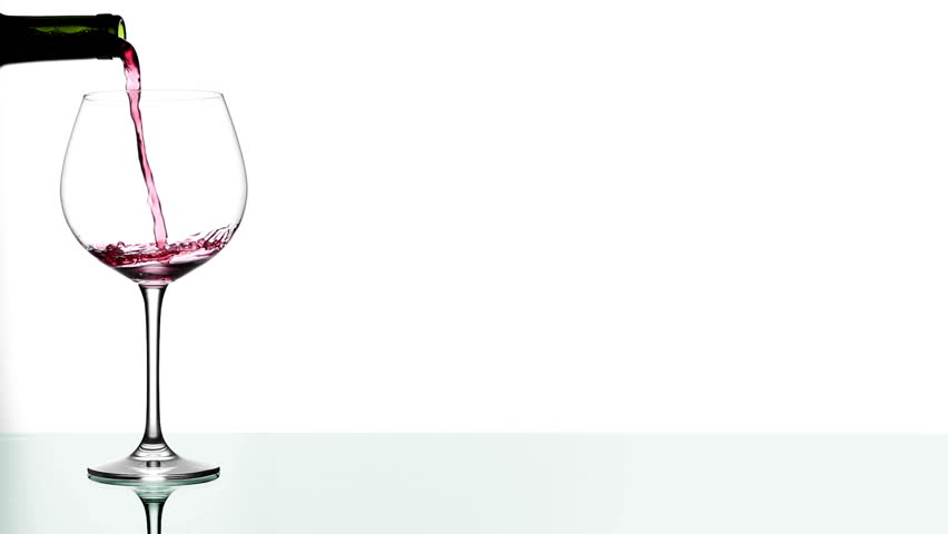 Red Wine Poured in Glass on Table