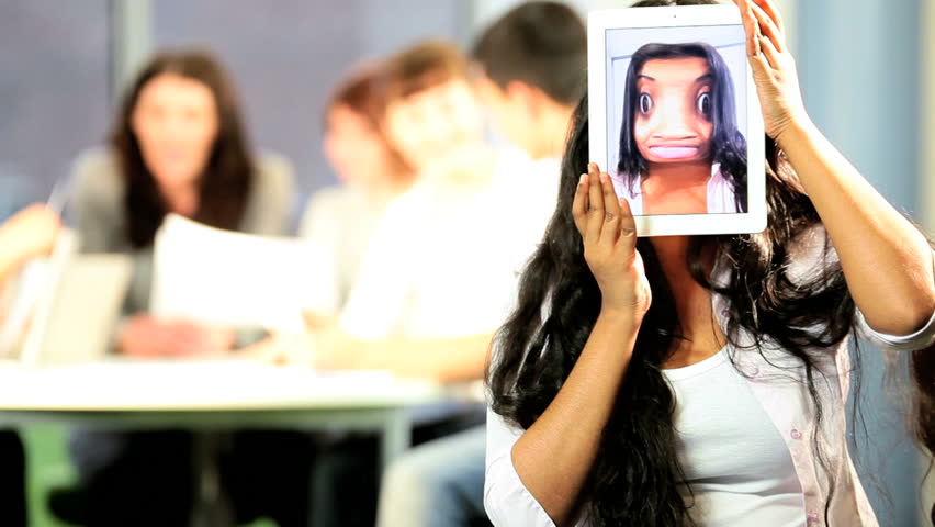 Portrait of university Indian female classmate have fun on IT lecture in students classroom