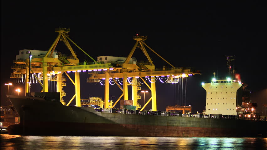 Cargo ship moving load at port Time lapse
