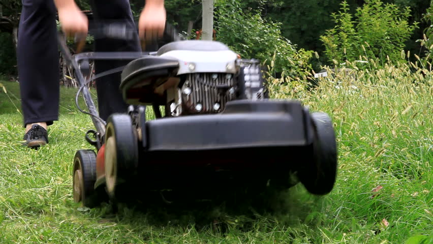 Mowing grass with Lawnmower
