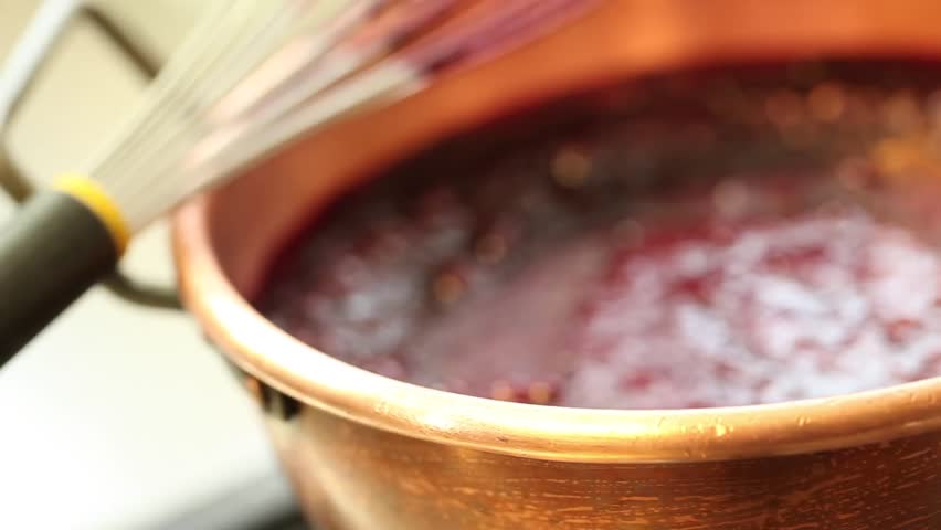 red fruit marmalade in a copper pot