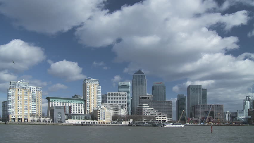 LONDON - CIRCA 2008: Time-lapse of Canary Wharf and Docklands with boats on river in the foreground circa 2008 in London, England.