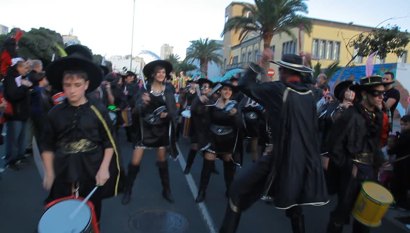 LAS PALMAS DE GRAN CANARIA, SPAIN - FEBRUARY 18: 200,000 masked revelers and a hundred or so festooned cars and floats in the Grande Parade (Gran Cabalgata ) of the Carnival February 18, 2012, Spain 