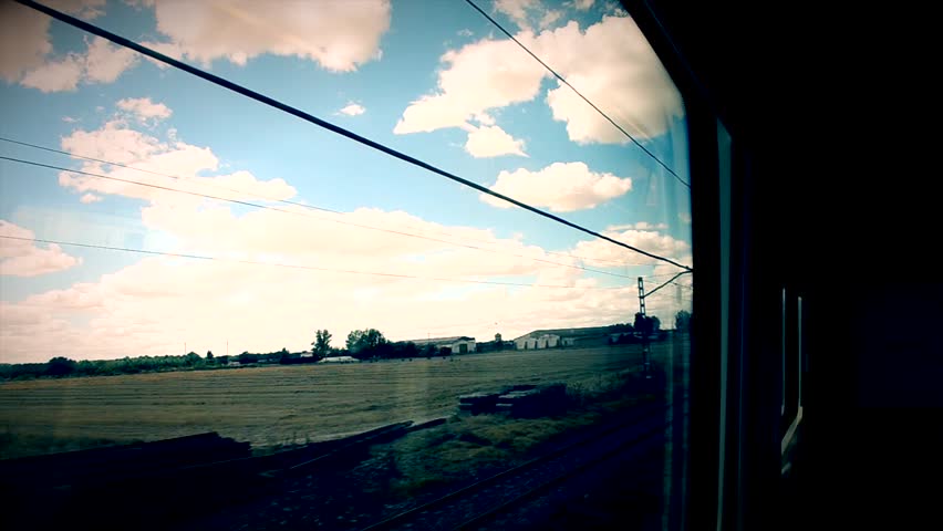 View of the landscape from a window of quickly going train circa 2011 in the region of Madrid, Spain. Loop.