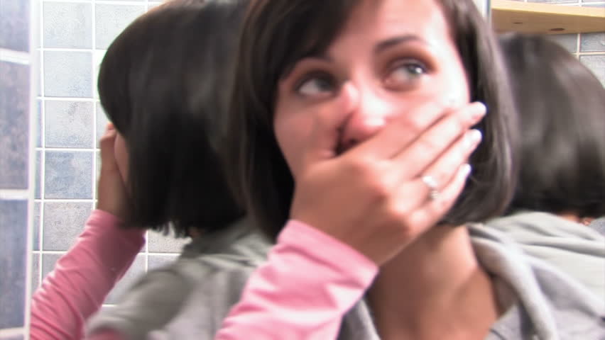 woman shows emotions in the mirror 