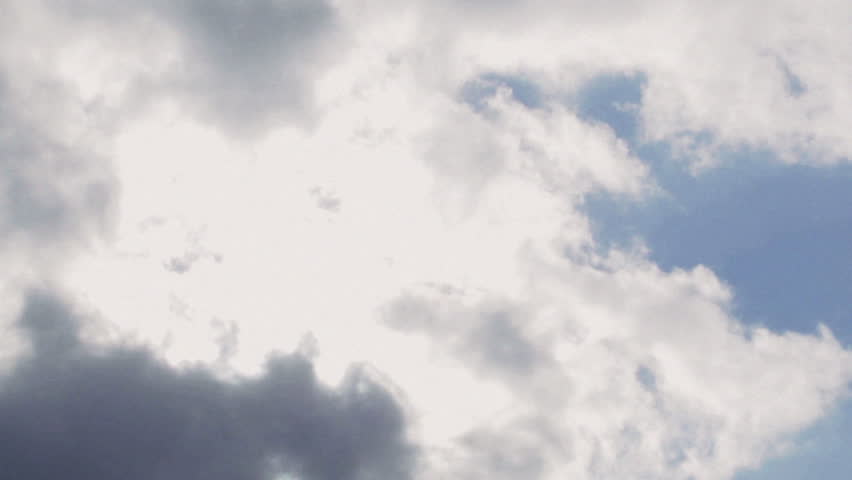 Bright clouds time lapse. Color corrected cross-process, film grain.