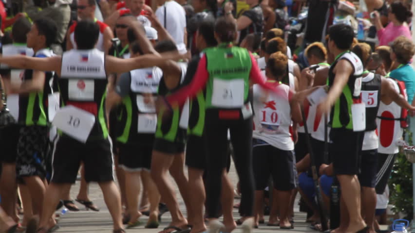 HONG KONG - JULY 8: The Dragon Boat team warming up before Hong Kong International Dragon Boat Races on July 8, 2012 in Hong Kong, China.