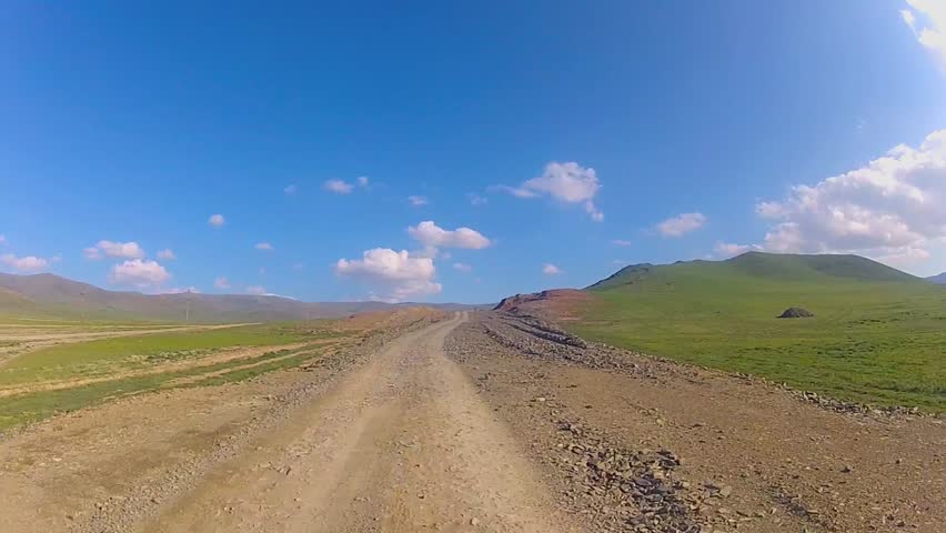 Vehicle point-of-view on a rally competition driving along mountains