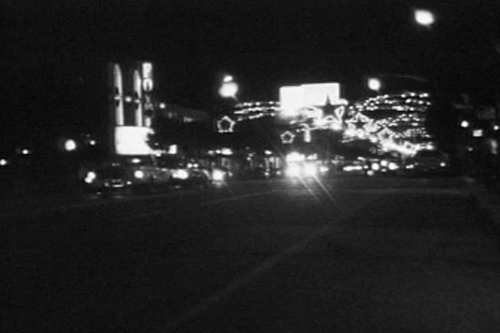 HOLLYWOOD CALIFORNIA - DECEMBER 2:  Vintage super 8 night time lapse  footage of Christmas holiday lights and traffic on December 2, 1986 in Hollywood, California. 