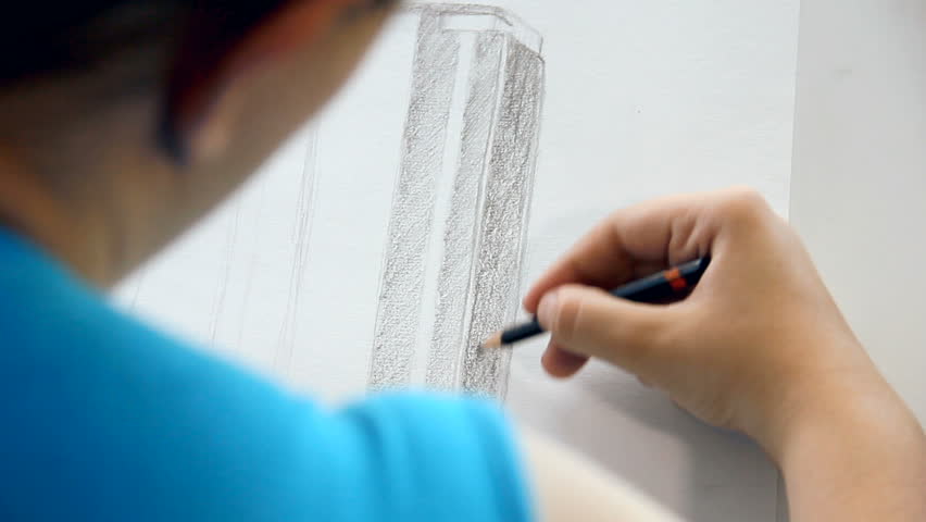 Drawing a business skyscraper with pencil and without other tools. Young woman wanted to be an architect.