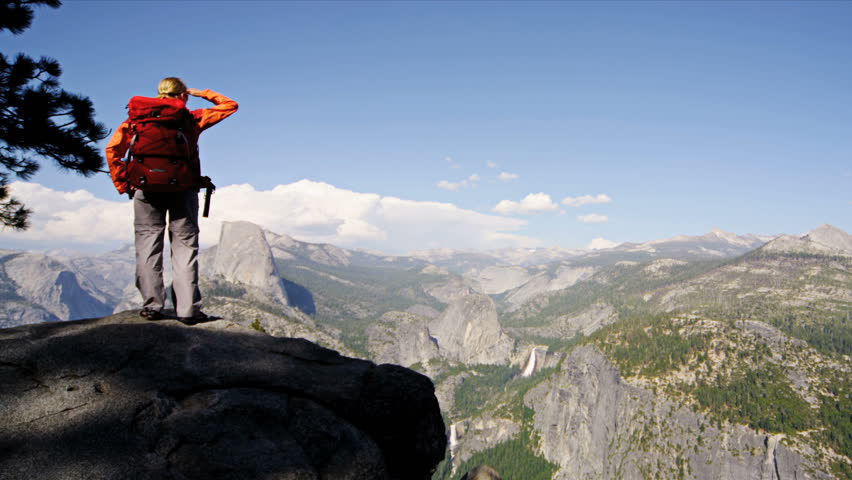 Lone female standing on the edge admiring the scenery, Shot on Red Epic