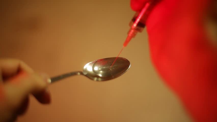 heroin addict with a needle.