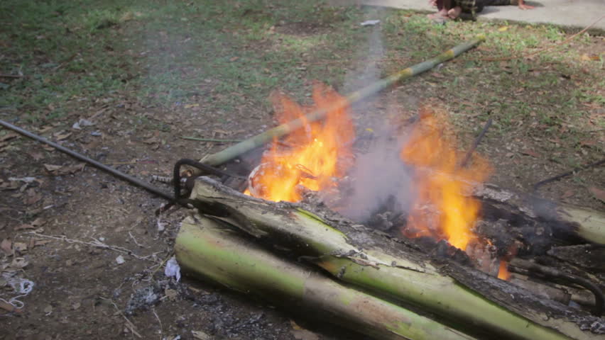 burning dead body in Balinese funeral, Bali, Indonesia