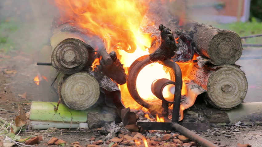closeup of burning dead body in Balinese funeral, Bali, Indonesia