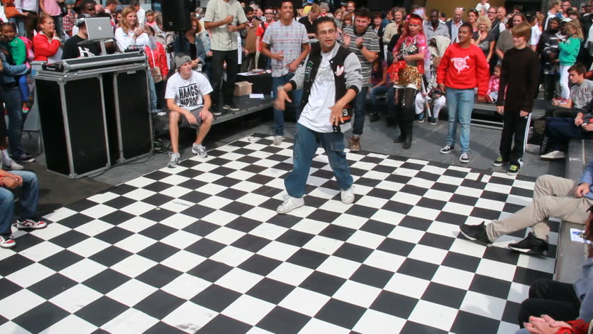 THE HAGUE, HOLLAND - AUGUST 30: Boy dances on an outdoor dance floor at Out Festival in The Hague, Holland on August 30, 2012. The Out Festival is an annual cultural festival in The Hague.