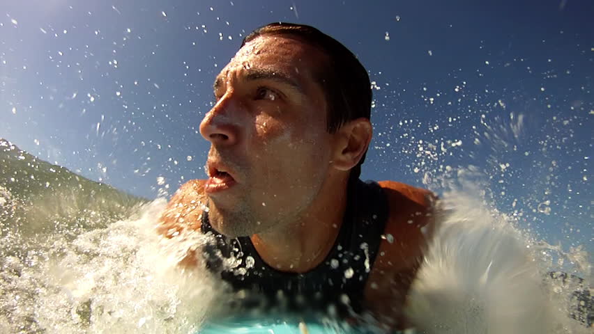 A Young Man Enjoying the Surfing in Waves
